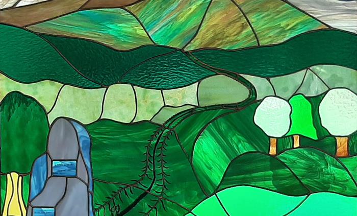 Our stained glass window by artist Stephen Bradley